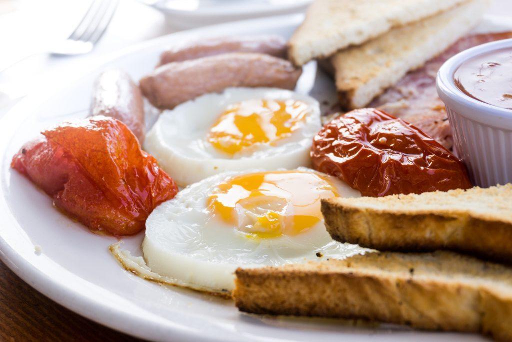 Egg and Toast - classical english breakfast with egg and ham